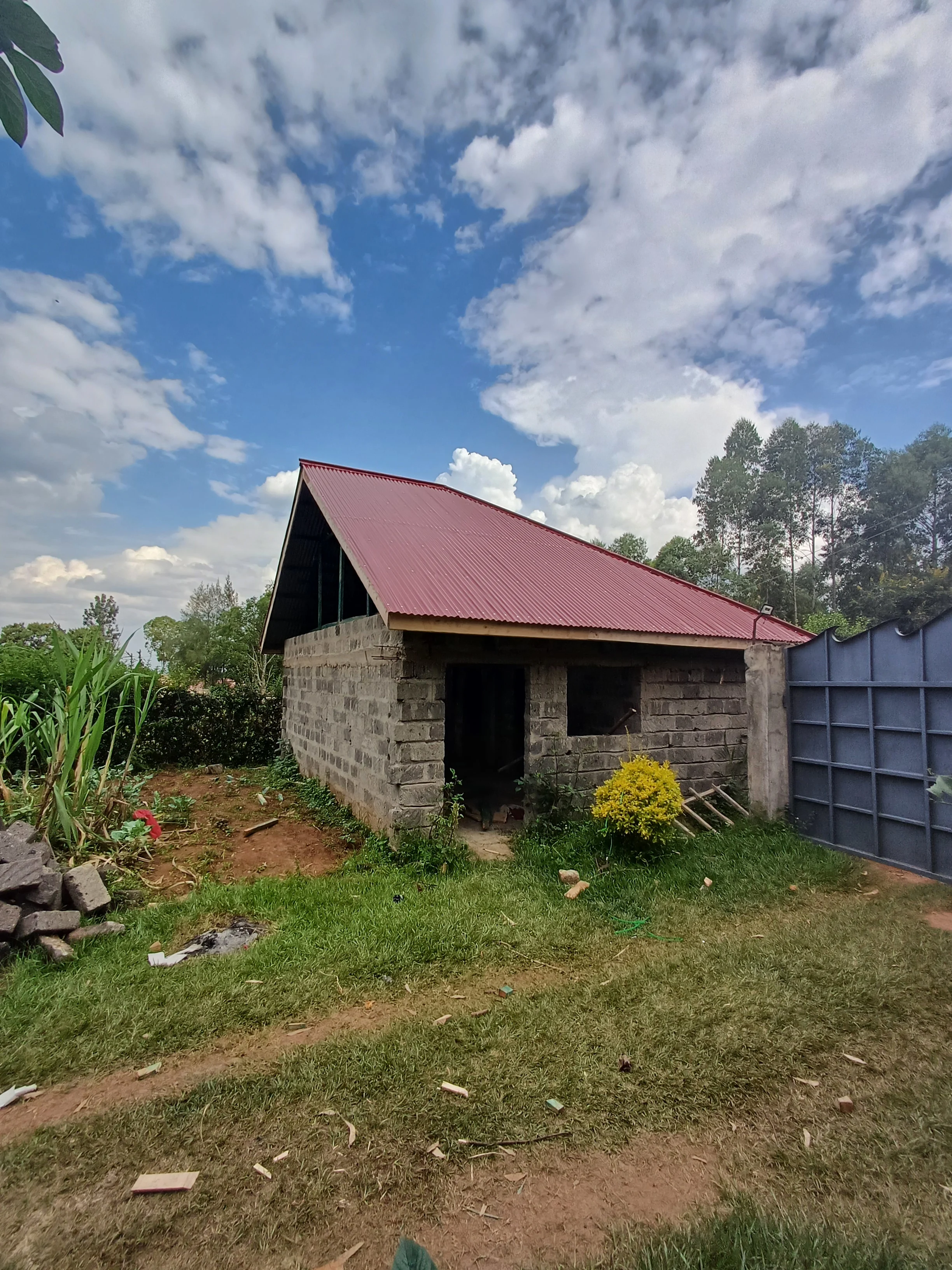 Final exterior view of completed house in Oruba